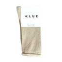Flatlay van beige glittersokken van Klue, bamboevezel met glanzende draad en zachte gerolde boord.